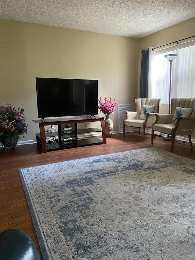 9771 SW 97th Ln, Ocala, FL 34481 - living room featuring wood finished floors and a textured ceiling