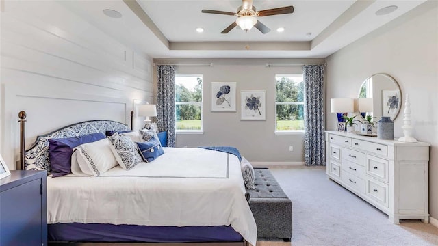 4253 SW 54th Street Rd, Ocala, FL 34474 - bedroom with a raised ceiling, light carpet, and a ceiling fan
