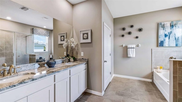 4253 SW 54th Street Rd, Ocala, FL 34474 - bathroom with double vanity, a bath, a tile shower, and tile patterned flooring