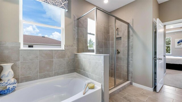 4253 SW 54th Street Rd, Ocala, FL 34474 - full bathroom featuring connected bathroom, a bath, a stall shower, tile patterned flooring, and recessed lighting