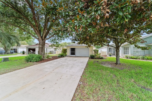 9117 SW 93rd Cir, Ocala, FL 34481 - view of front facade featuring driveway, a front lawn, and stucco siding