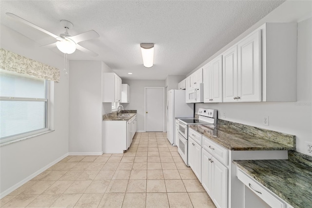 9117 SW 93rd Cir, Ocala, FL 34481 - kitchen featuring white appliances, white cabinets, a textured ceiling, ceiling fan, and light tile patterned floors