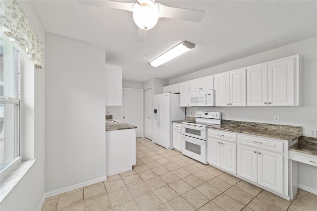 9117 SW 93rd Cir, Ocala, FL 34481 - kitchen featuring white appliances, white cabinets, ceiling fan, and light tile patterned flooring