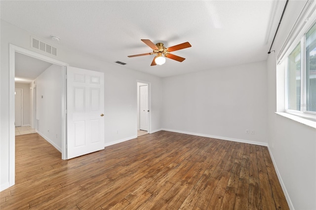 9117 SW 93rd Cir, Ocala, FL 34481 - unfurnished room featuring hardwood / wood-style floors, ceiling fan, and a smoke detector