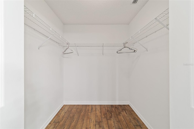 9117 SW 93rd Cir, Ocala, FL 34481 - walk in closet with hardwood / wood-style flooring