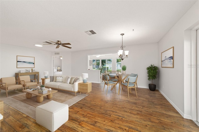 9117 SW 93rd Cir, Ocala, FL 34481 - living area featuring wood-type flooring, a chandelier, and a ceiling fan