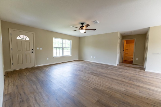 21 Locust Loop Radl, Ocala, FL 34472 - unfurnished living room with wood finished floors and ceiling fan