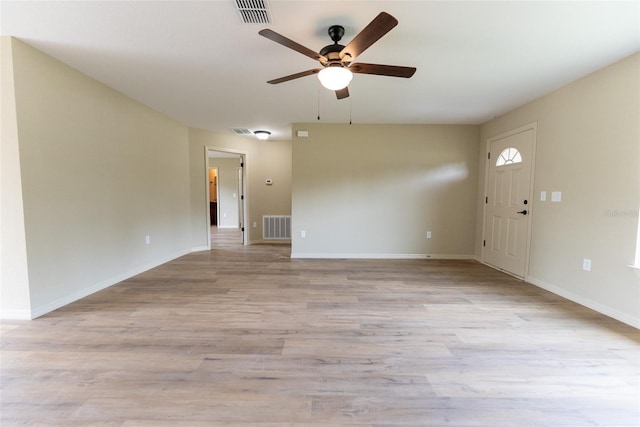 21 Locust Loop Radl, Ocala, FL 34472 - unfurnished living room featuring ceiling fan and light wood-style floors