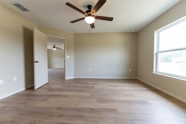 21 Locust Loop Radl, Ocala, FL 34472 - empty room featuring ceiling fan, healthy amount of natural light, and light wood finished floors