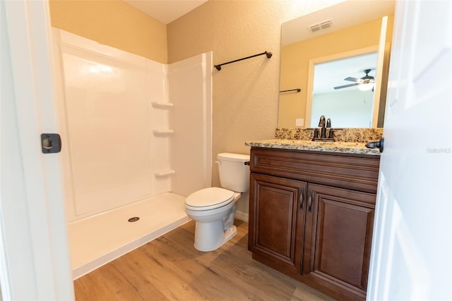 21 Locust Loop Radl, Ocala, FL 34472 - bathroom with vanity, wood finished floors, a shower, ceiling fan, and a textured wall