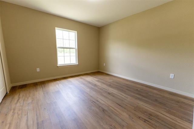21 Locust Loop Radl, Ocala, FL 34472 - unfurnished room with wood finished floors
