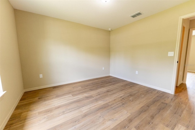 21 Locust Loop Radl, Ocala, FL 34472 - empty room with light wood-type flooring and baseboards