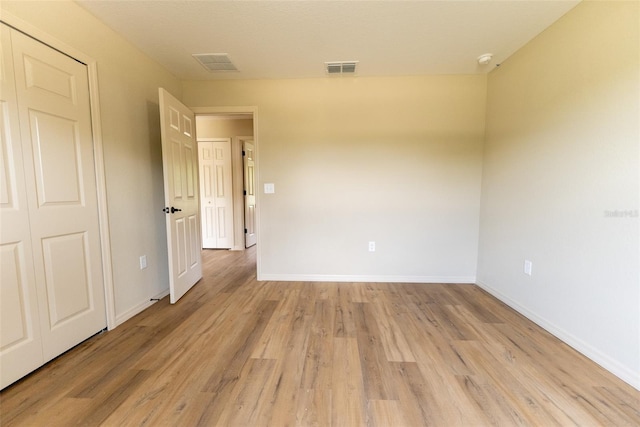 21 Locust Loop Radl, Ocala, FL 34472 - spare room with light wood-style floors and a smoke detector