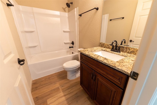 21 Locust Loop Radl, Ocala, FL 34472 - full bathroom featuring wood finished floors, a textured wall, vanity, and tub / shower combination