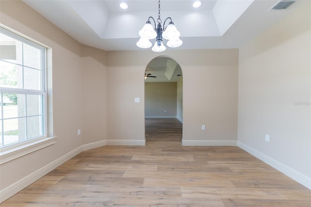 45 Pecan Course Loop, Ocala, FL 34472 - unfurnished room with a tray ceiling, a chandelier, ceiling fan, light wood-style floors, and recessed lighting