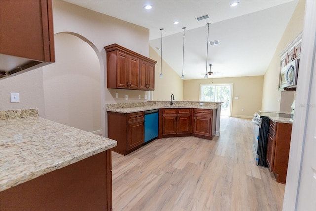 45 Pecan Course Loop, Ocala, FL 34472 - kitchen featuring appliances with stainless steel finishes, a peninsula, light wood-type flooring, vaulted ceiling, and a ceiling fan