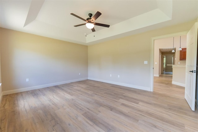 45 Pecan Course Loop, Ocala, FL 34472 - spare room with a raised ceiling, ceiling fan, and light wood-style flooring