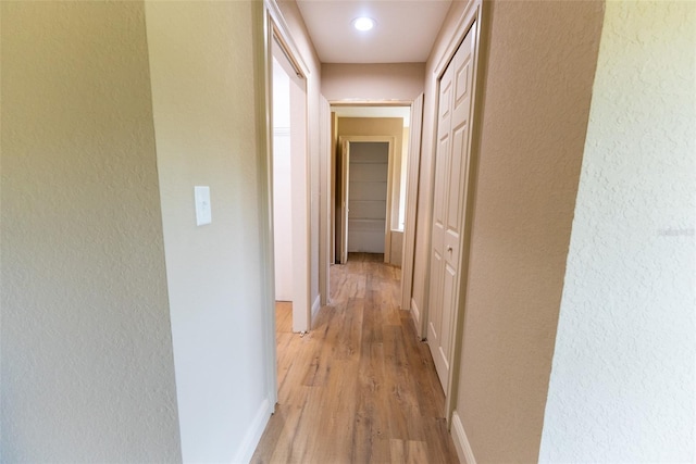 45 Pecan Course Loop, Ocala, FL 34472 - corridor featuring light wood-style flooring, a textured wall, and recessed lighting