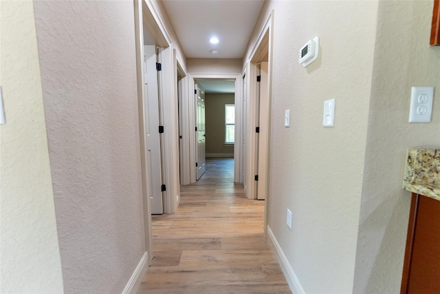 45 Pecan Course Loop, Ocala, FL 34472 - hall featuring light wood-style flooring and a textured wall