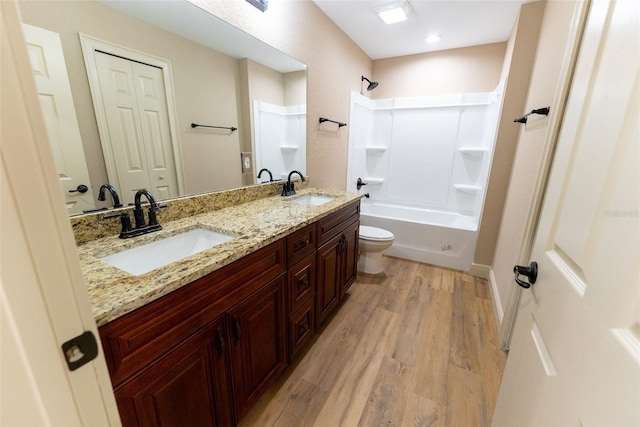 45 Pecan Course Loop, Ocala, FL 34472 - bathroom with double vanity, wood finished floors, and washtub / shower combination