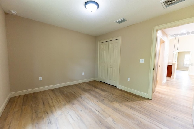 45 Pecan Course Loop, Ocala, FL 34472 - unfurnished bedroom featuring light wood-style flooring and a closet