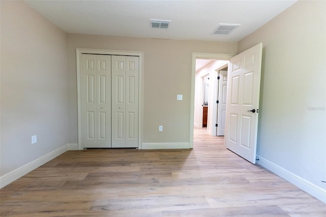 45 Pecan Course Loop, Ocala, FL 34472 - unfurnished bedroom with light wood-style flooring and a closet