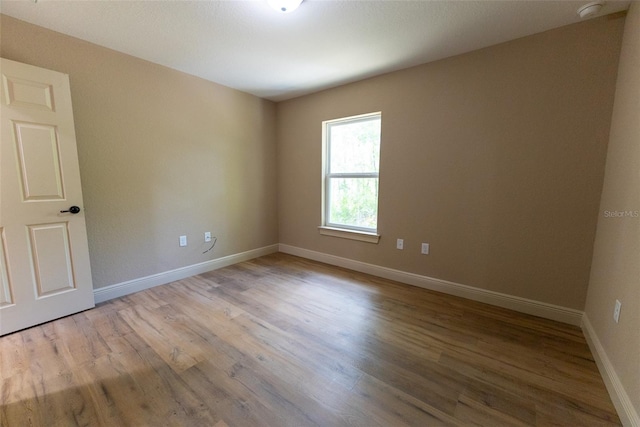 45 Pecan Course Loop, Ocala, FL 34472 - unfurnished room featuring wood finished floors and a smoke detector