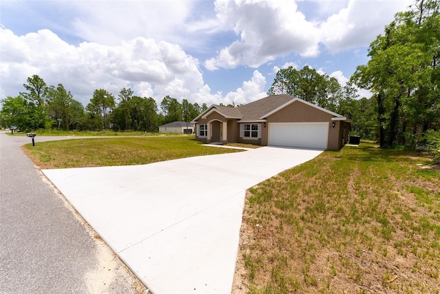45 Pecan Course Loop, Ocala, FL 34472 - single story home featuring a garage, a front lawn, concrete driveway, and stucco siding