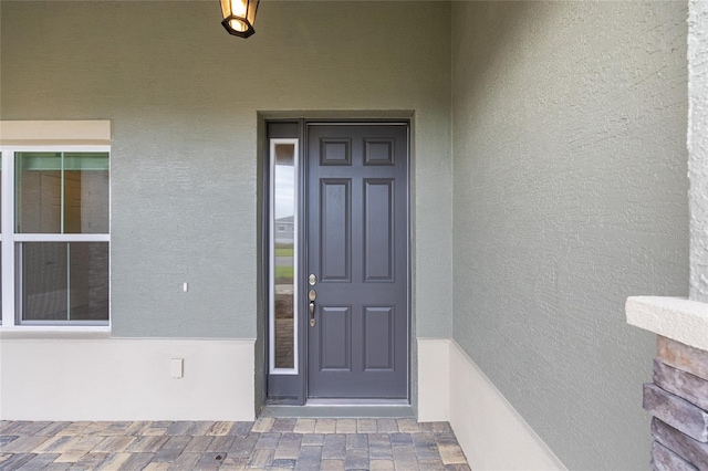 10880 SW 101st Loop, Ocala, FL 34481 - view of exterior entry featuring stucco siding