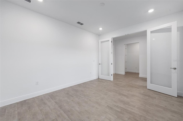 10880 SW 101st Loop, Ocala, FL 34481 - basement with light wood-style flooring, recessed lighting, and french doors