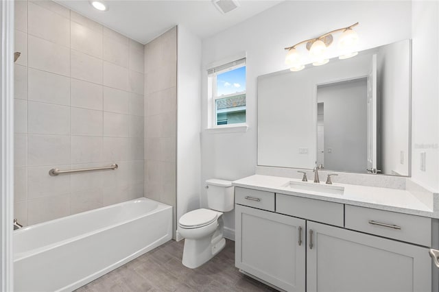 10880 SW 101st Loop, Ocala, FL 34481 - bathroom with vanity, wood finished floors, and shower / bathtub combination