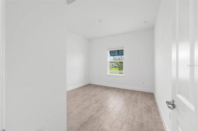 10880 SW 101st Loop, Ocala, FL 34481 - spare room with light wood-style flooring and baseboards