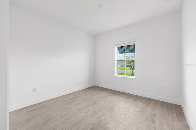 10880 SW 101st Loop, Ocala, FL 34481 - unfurnished room with light wood finished floors and baseboards