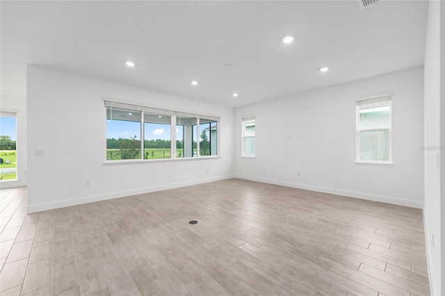 10880 SW 101st Loop, Ocala, FL 34481 - unfurnished room with healthy amount of natural light, light wood-style flooring, and recessed lighting