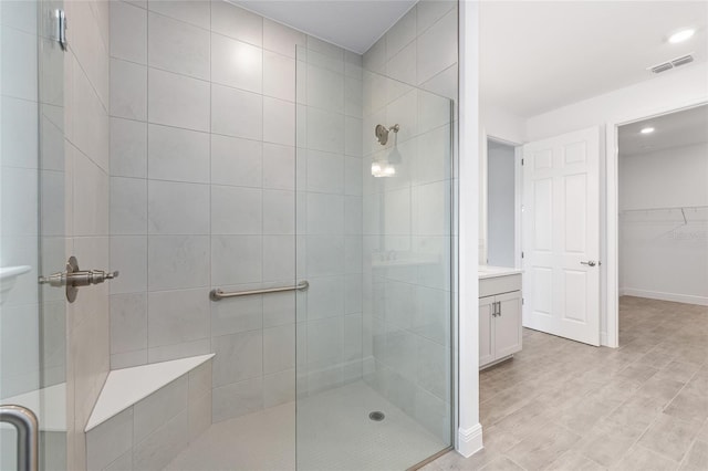 10880 SW 101st Loop, Ocala, FL 34481 - full bathroom with tiled shower, vanity, a walk in closet, and recessed lighting