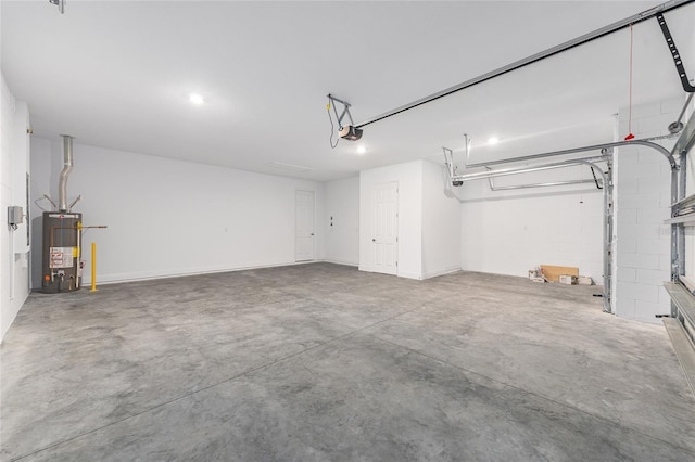 10880 SW 101st Loop, Ocala, FL 34481 - garage featuring gas water heater and a garage door opener