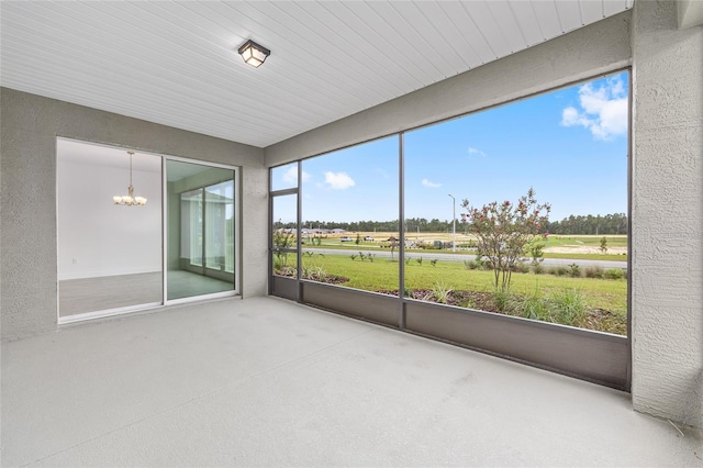 10880 SW 101st Loop, Ocala, FL 34481 - unfurnished sunroom featuring a chandelier and golf course view