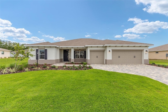 10833 SW 101st Loop, Ocala, FL 34481 - single story home featuring stucco siding, an attached garage, a front yard, and decorative driveway
