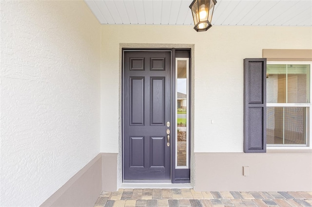 10833 SW 101st Loop, Ocala, FL 34481 - property entrance with stucco siding