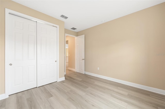10833 SW 101st Loop, Ocala, FL 34481 - unfurnished bedroom with light wood-style flooring and a closet