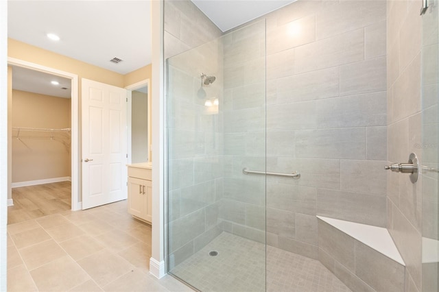 10833 SW 101st Loop, Ocala, FL 34481 - full bath featuring tiled shower, vanity, a spacious closet, and recessed lighting