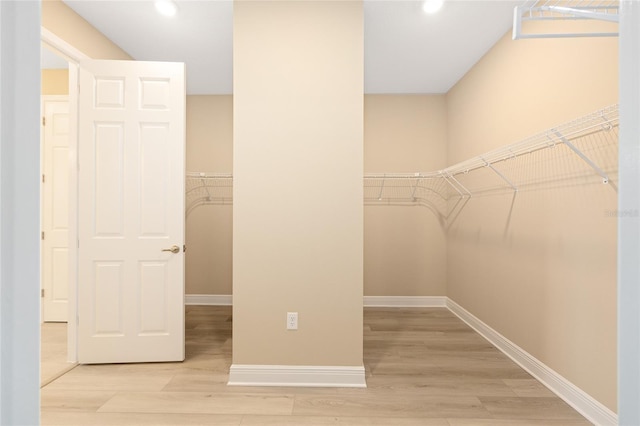 10833 SW 101st Loop, Ocala, FL 34481 - walk in closet featuring wood finished floors