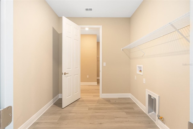 10833 SW 101st Loop, Ocala, FL 34481 - laundry room featuring hookup for a washing machine and light wood-style flooring