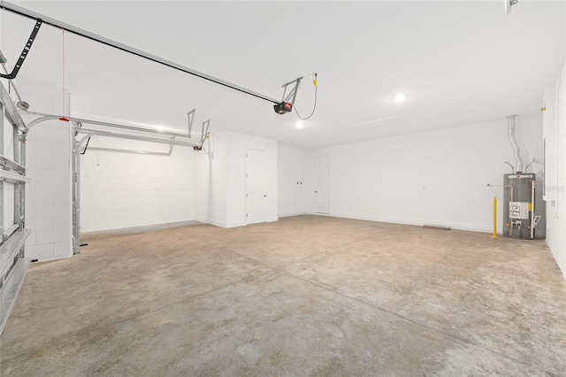 10833 SW 101st Loop, Ocala, FL 34481 - garage with gas water heater and a garage door opener