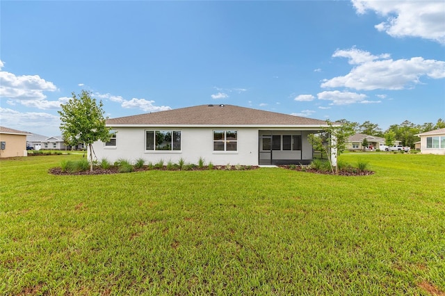 10833 SW 101st Loop, Ocala, FL 34481 - back of house featuring stucco siding and a lawn