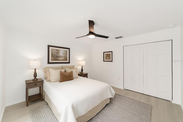 1581 SW Paradise Heights Rd, Dunnellon, FL 34431 - bedroom featuring light wood finished floors, a closet, and a ceiling fan