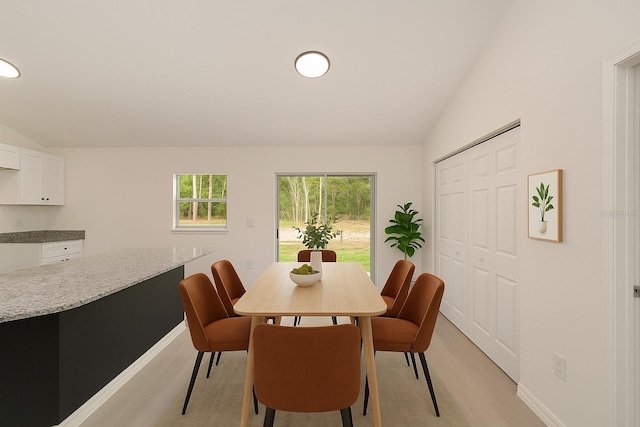 1581 SW Paradise Heights Rd, Dunnellon, FL 34431 - dining space with vaulted ceiling and light wood finished floors