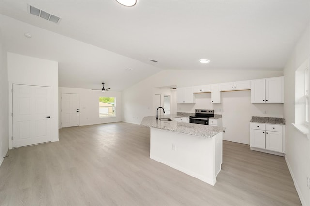 1581 SW Paradise Heights Rd, Dunnellon, FL 34431 - kitchen featuring stainless steel electric stove, lofted ceiling, light wood-type flooring, white cabinetry, and a ceiling fan