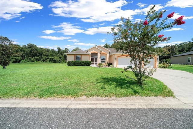 19583 SW 77th Loop, Dunnellon, FL 34432 - single story home with driveway, an attached garage, a front lawn, and stucco siding