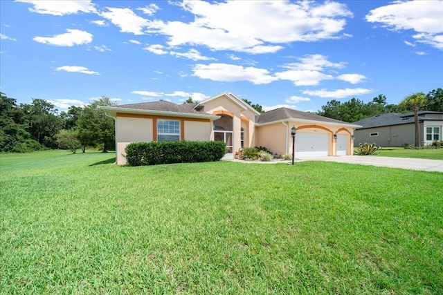 19583 SW 77th Loop, Dunnellon, FL 34432 - single story home featuring an attached garage, stucco siding, concrete driveway, and a front yard